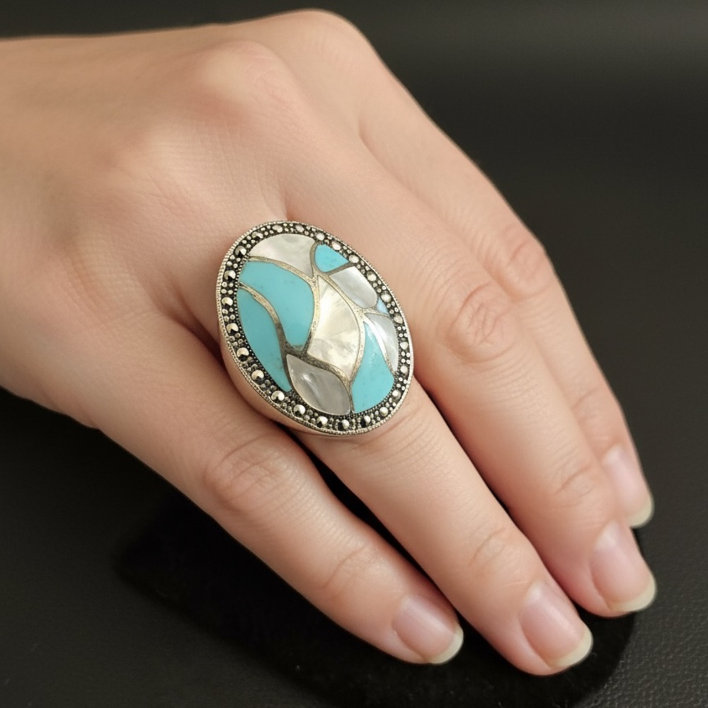 Genuine, turquoise‎ and mother of pearl sterling silver ring.
